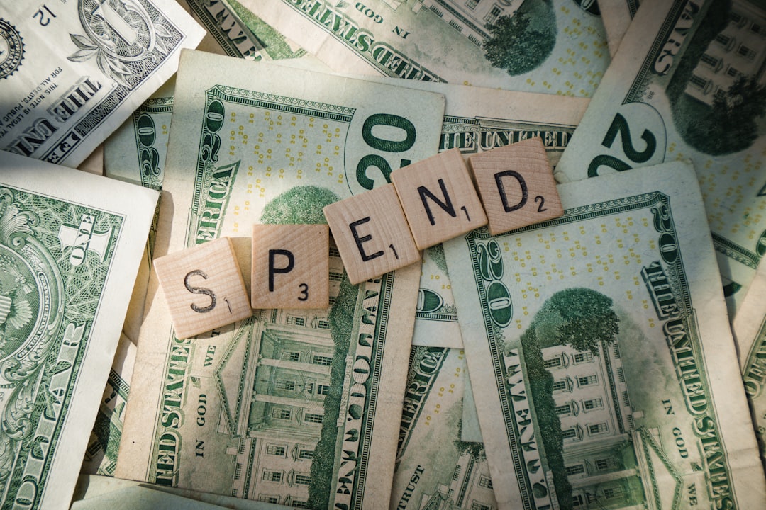 Scrabble letters spelling spend on American bills